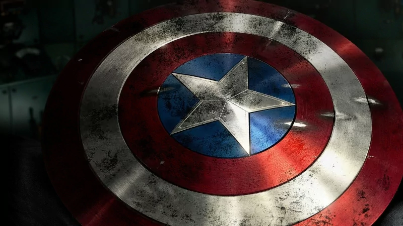 Close-up of Captain America's weathered circular shield with star emblem, from the movie Captain America: The First Avenger.