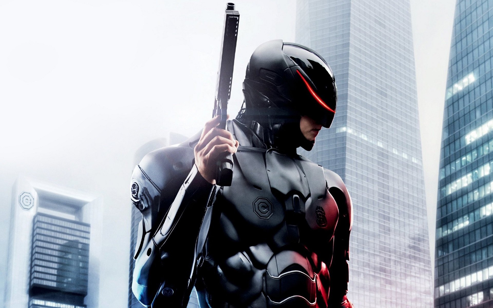 Cyborg officer from the 2014 movie Robocop, standing in a futuristic cityscape with a high-tech weapon.