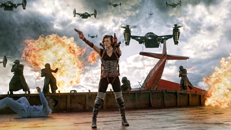 Alice, played by Milla Jovovich, stands armed amid explosions and drones in an action scene from the movie Resident Evil: Retribution.