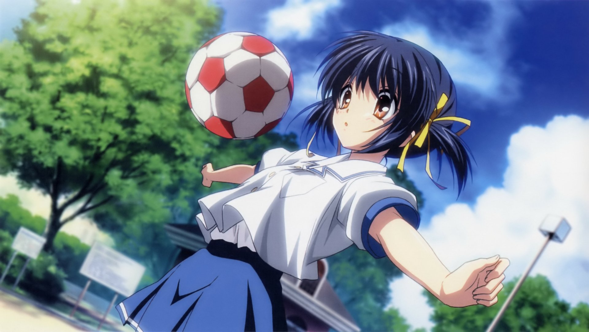 Clannad anime girl in a school uniform balancing a soccer ball outdoors beneath a blue sky, twin ponytails tied with yellow ribbons and expressive brown eyes.