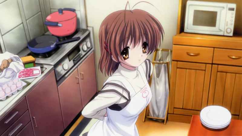 Anime scene from Clannad showing a girl with brown hair and large eyes wearing a white apron in a cozy kitchen with cooking utensils and appliances.