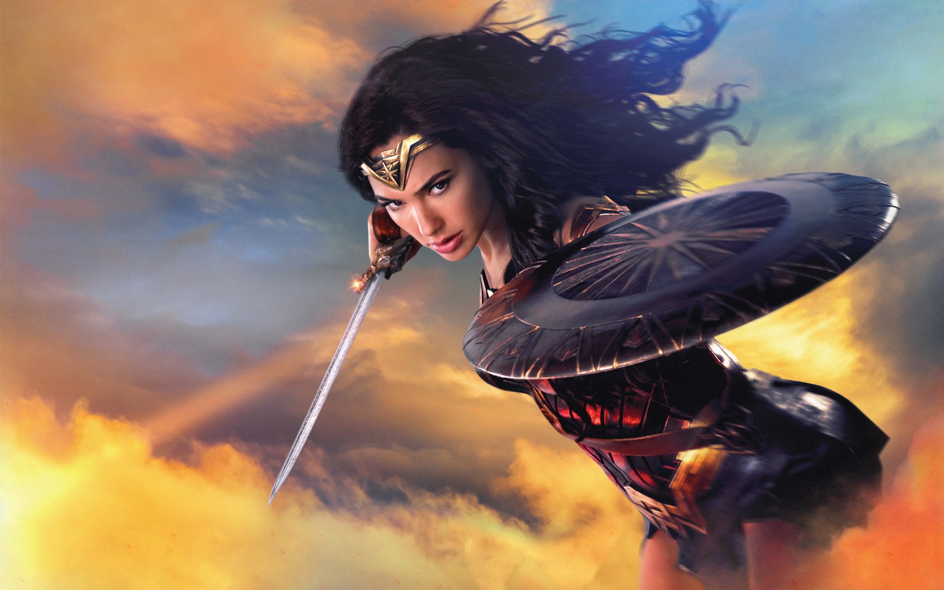 Gal Gadot portrays Diana Prince in this dynamic image from the movie Wonder Woman, showcasing her with a sword and shield against a vibrant sky.