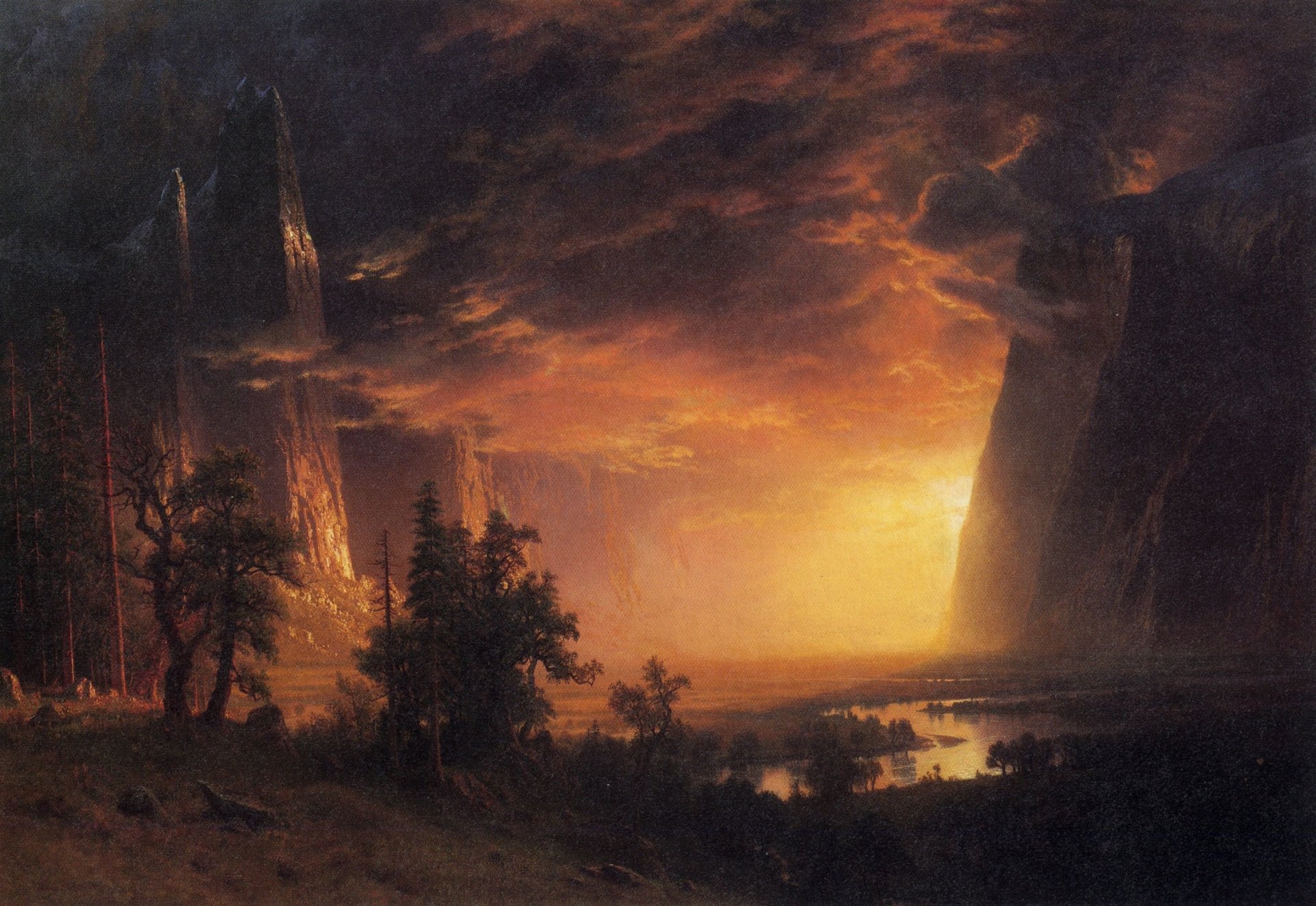 Artistic landscape of a sunlit valley with a winding river, silhouetted trees and towering rock spires beneath a dramatic glowing sky.