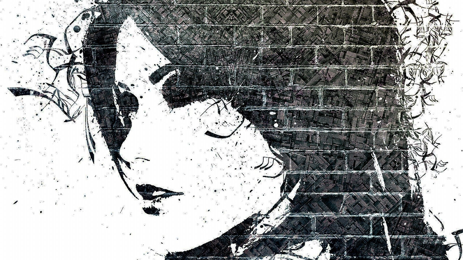 Artistic black-and-white mural of a woman's stylized face painted on a brick wall, with ink-splatter textures and floral accents.