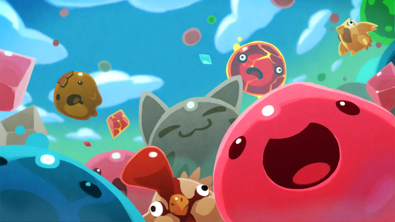 Slime Rancher video game scene: colorful, joyful slimes — round bubble slimes, a cat-shaped slime and other varieties — frolicking beneath a bright blue sky.
