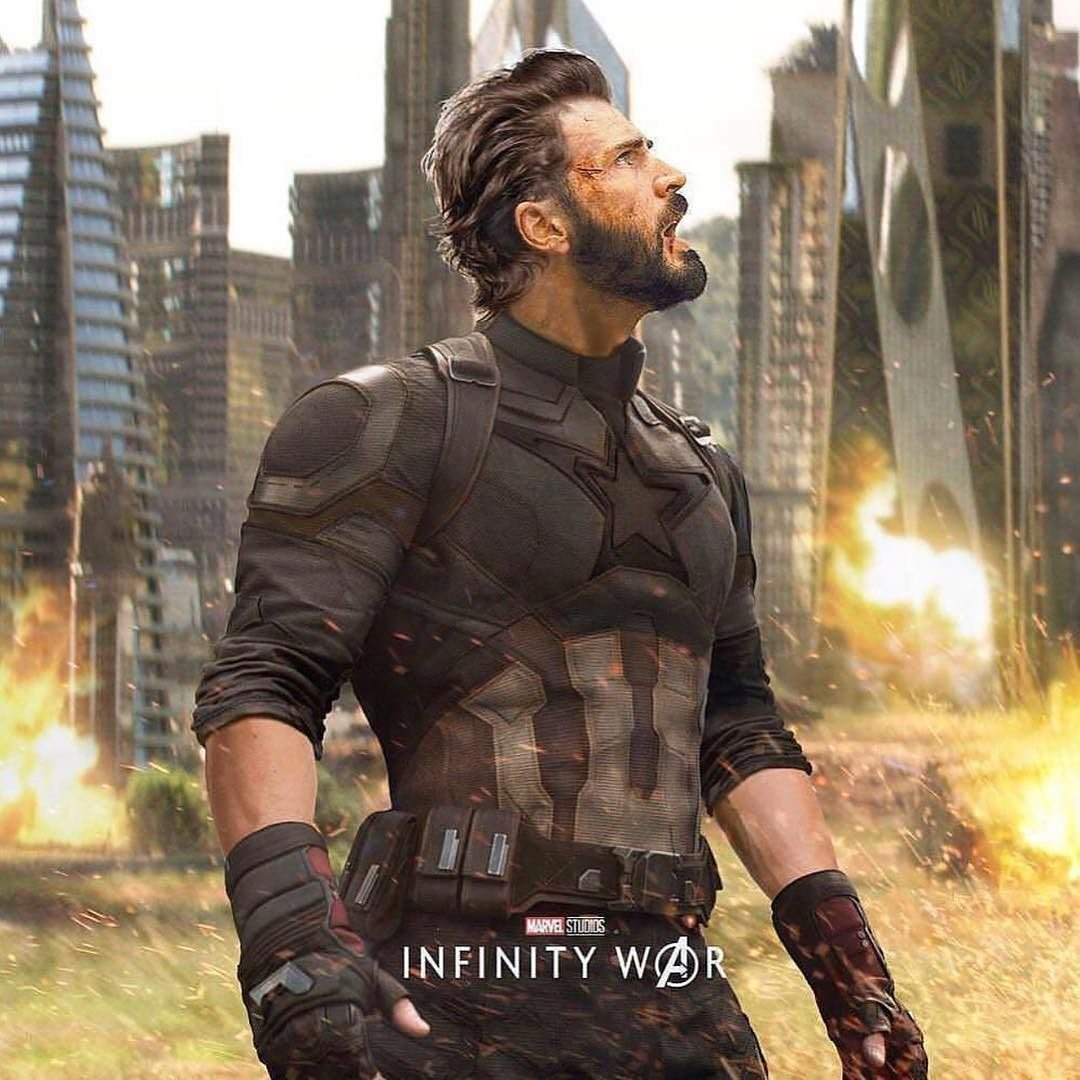 Steve Rogers as Captain America in Avengers: Infinity War — bearded and armored, looking up amid a burning, war-torn cityscape.
