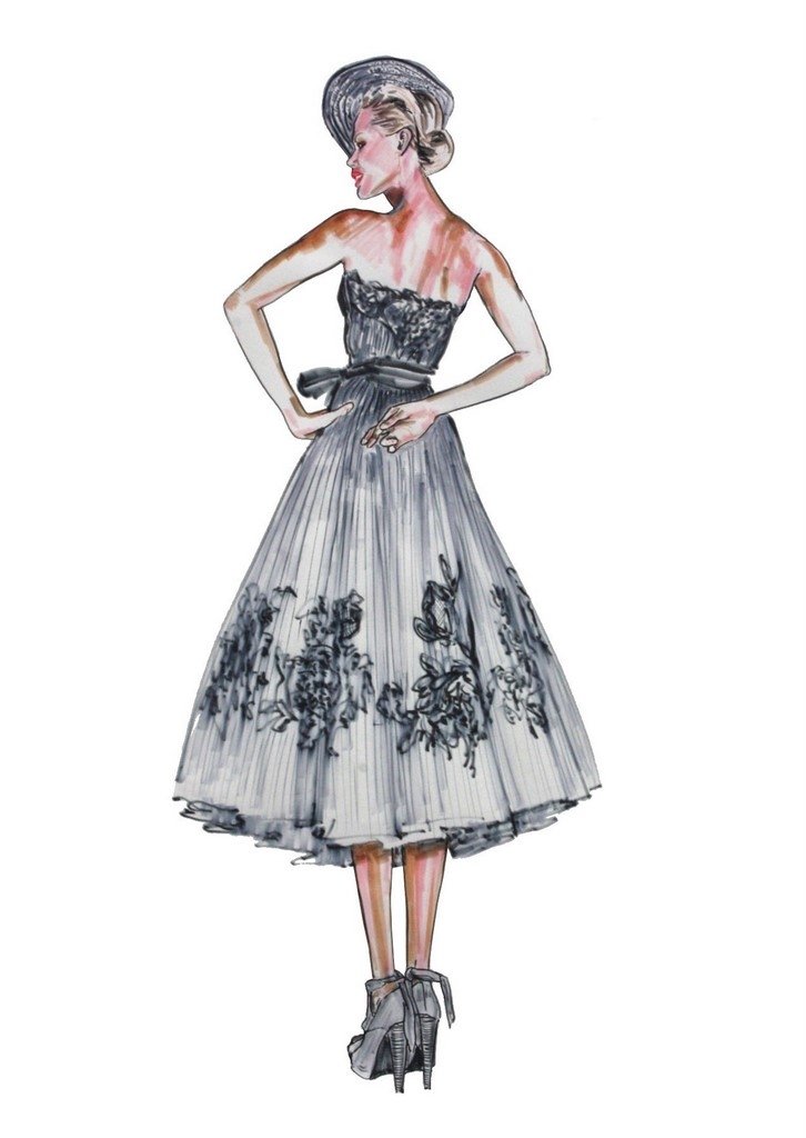 A fashion sketch by Katharine Lowrey features a woman in a fitted black bodice with a flowing, pleated skirt adorned with floral designs, complemented by high-heeled shoes and a chic hat.