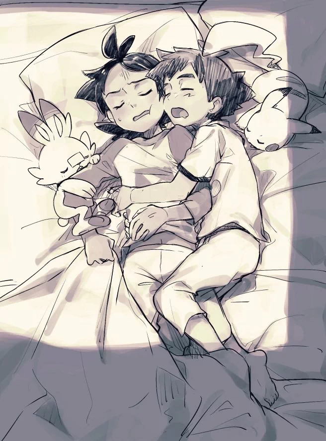 Ash Ketchum and Goh lie asleep together in pajamas, surrounded by their Pokémon Pikachu and Scorbunny, in a tender anime scene.
