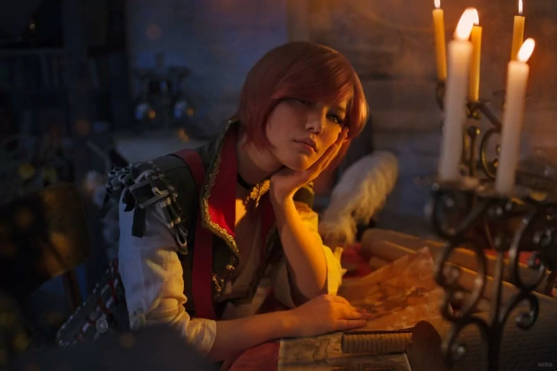 Shani from The Witcher 3: Wild Hunt sits thoughtfully at a candlelit table, surrounded by medieval objects in this scene from the video game.