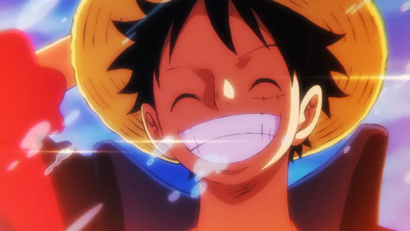 Monkey D. Luffy from One Piece smiling broadly with his straw hat tilted, sunlight and a colorful sky glowing behind him.