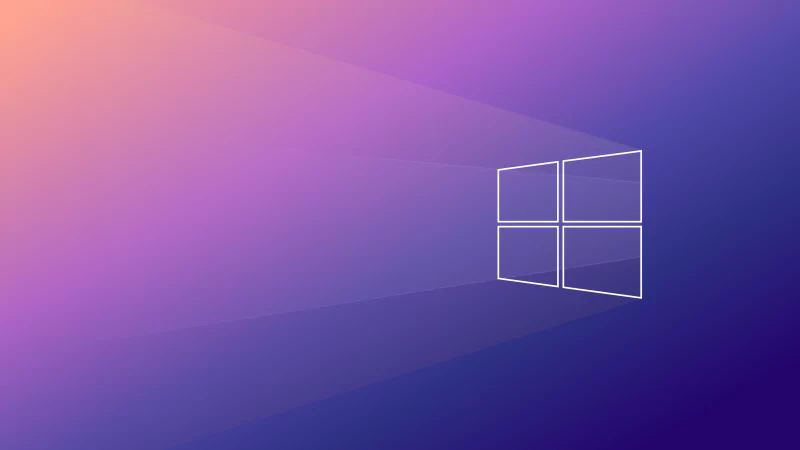 Blue-themed digital wallpaper featuring the Microsoft Windows 10 logo, representing the Windows operating system and modern computer technology.