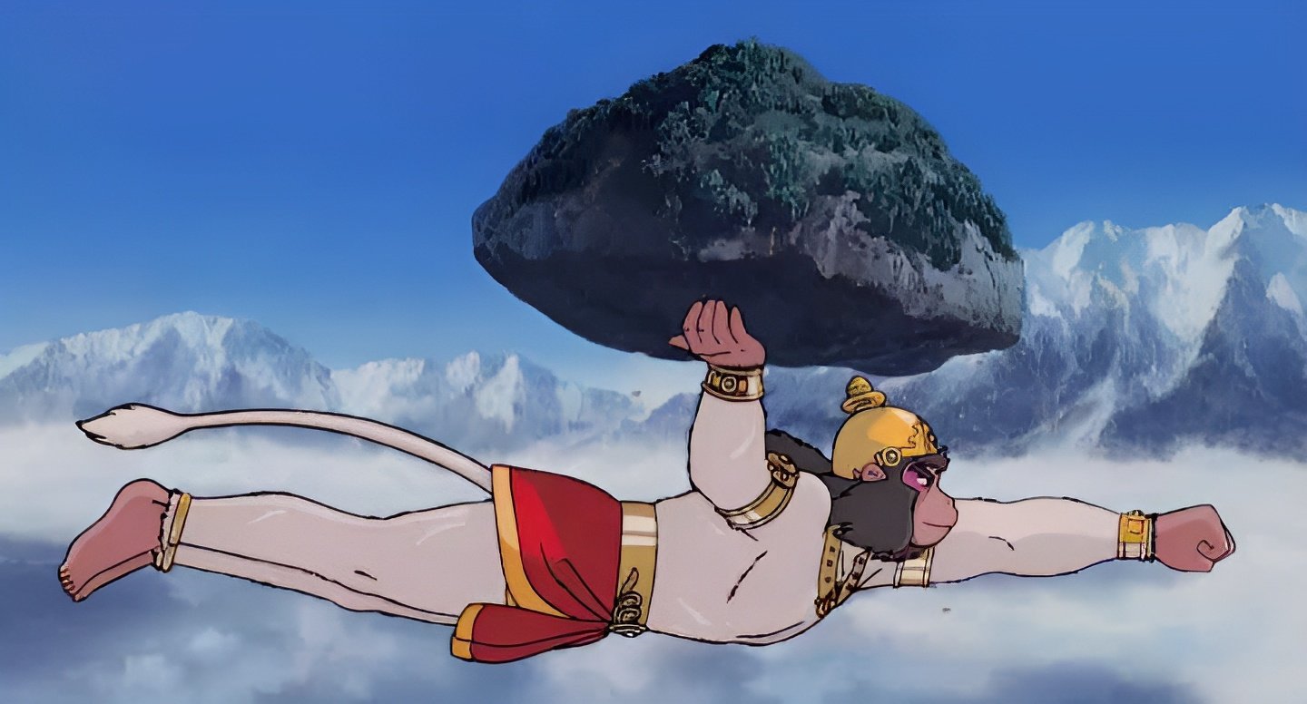 Anime-style religious scene from The Legend of Prince Rama: Lord Hanuman soars over snowy peaks holding a moss-covered mountain.
