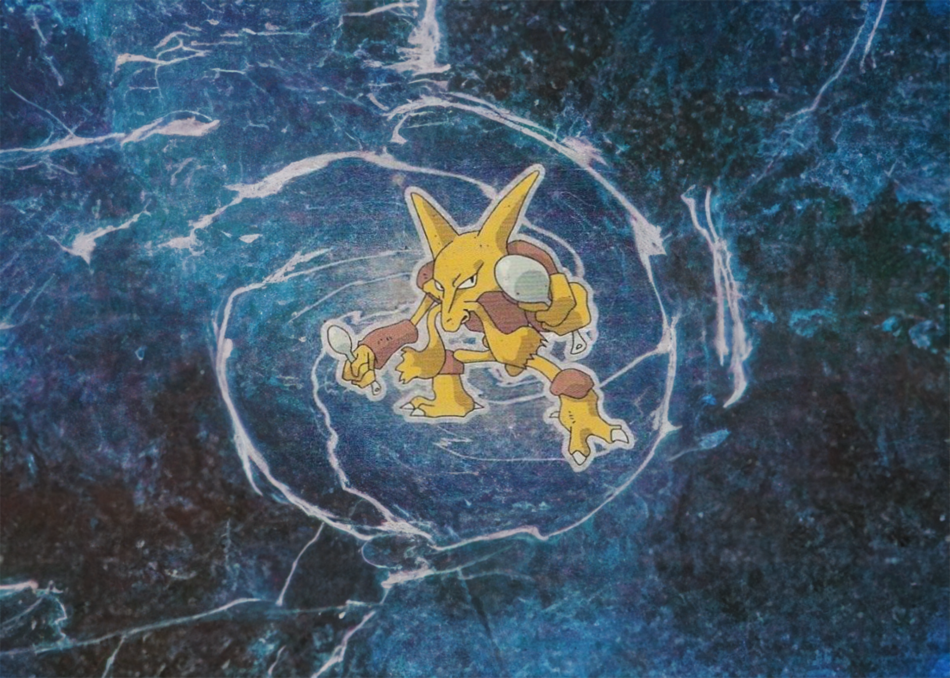 A Pokémon sticker of Kadabra with a spoon is placed on a textured, dark blue, swirling background.