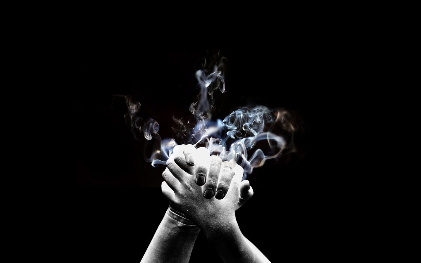 Artistic abstract image of clasped hands against a black background, with wispy, ethereal smoke rising upward.