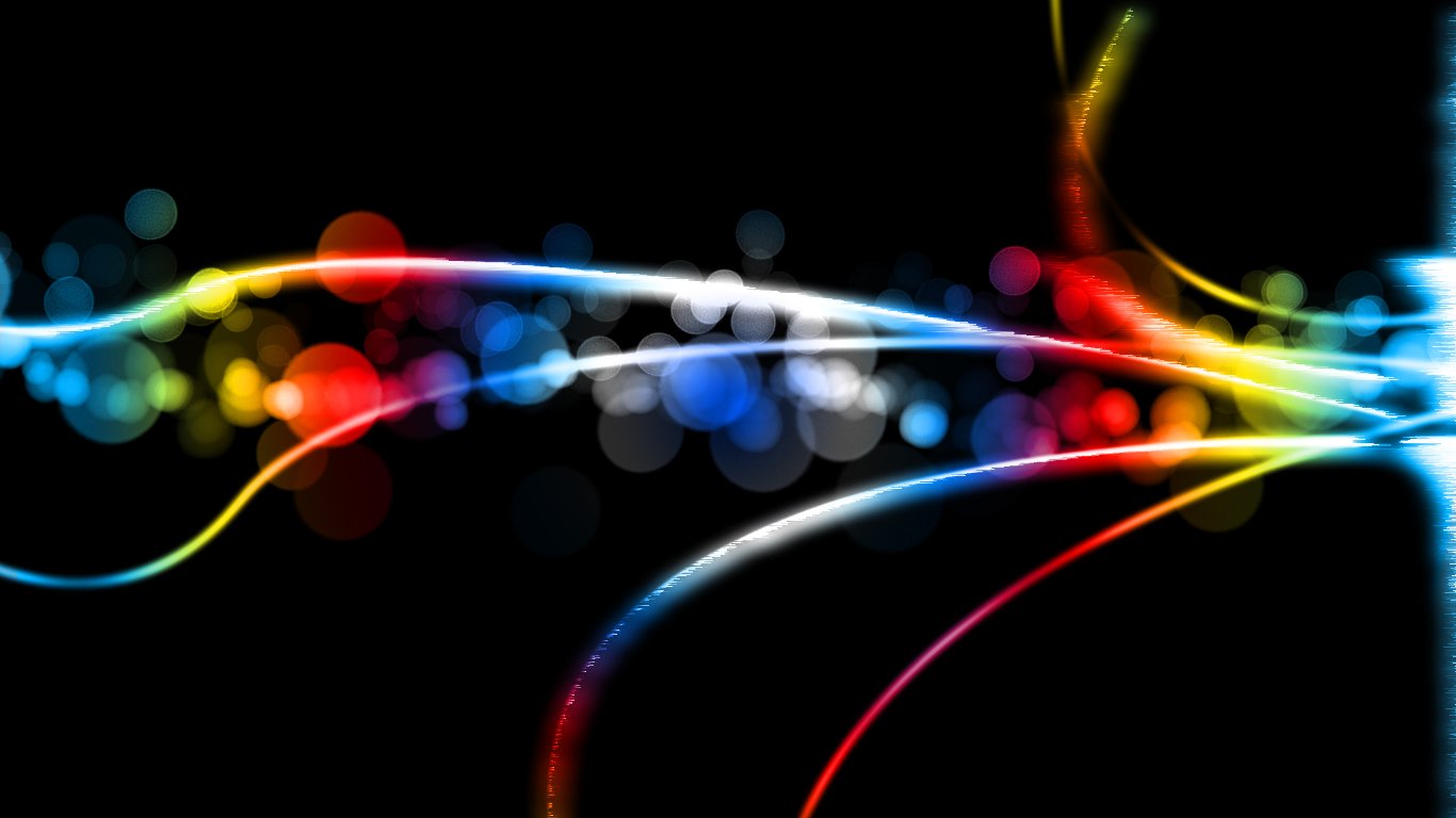 Abstract image featuring vibrant, colorful light trails and bokeh effects against a dark background, creating a dynamic and energetic visual.