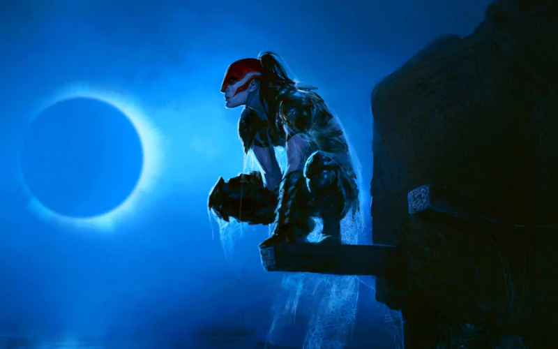 A dark, atmospheric scene features a man with a striking helmet, seated on a rocky ledge under a glowing blue moon, exuding a sense of strength and contemplation.