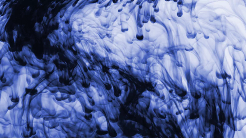 Abstract diffusion patterns in shades of blue and black create a fluid, swirling effect with intricate, flowing textures.