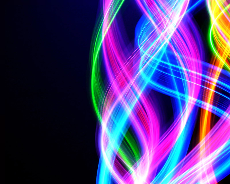 A vibrant display of swirling colorful light trails on a dark background, showcasing the beauty of artistic digital art.