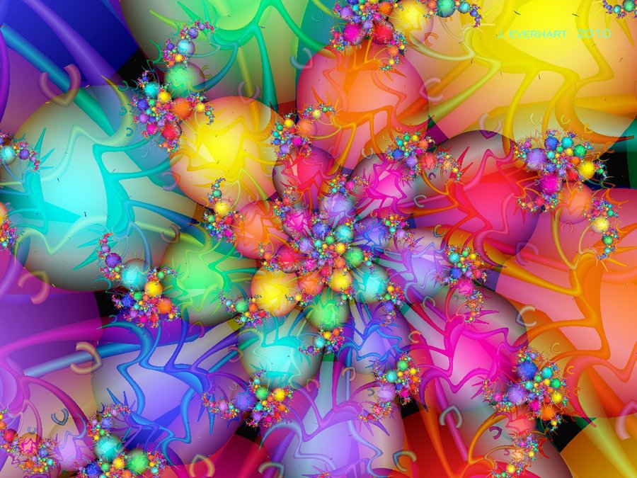 A vibrant digital art piece showcasing a colorful fractal design, featuring intricate patterns and glowing orbs in a kaleidoscope of hues.