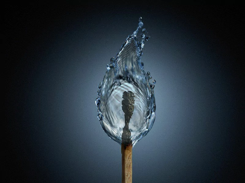 Fantasy CGI of a matchstick whose flame is sculpted from flowing water and droplets, glowing against a dark gradient background.
