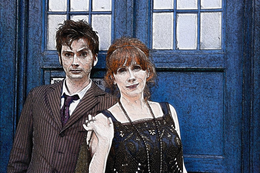 David Tennant and Catherine Tate stand in front of the TARDIS from the TV show Doctor Who (2005), both dressed in character.