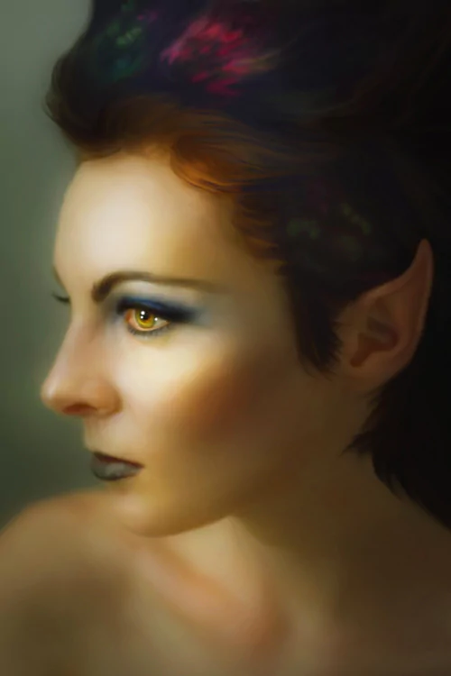 A fantasy portrait of a woman with pointed ears, glowing golden eyes, and dark, colorful hair against a blurred background.