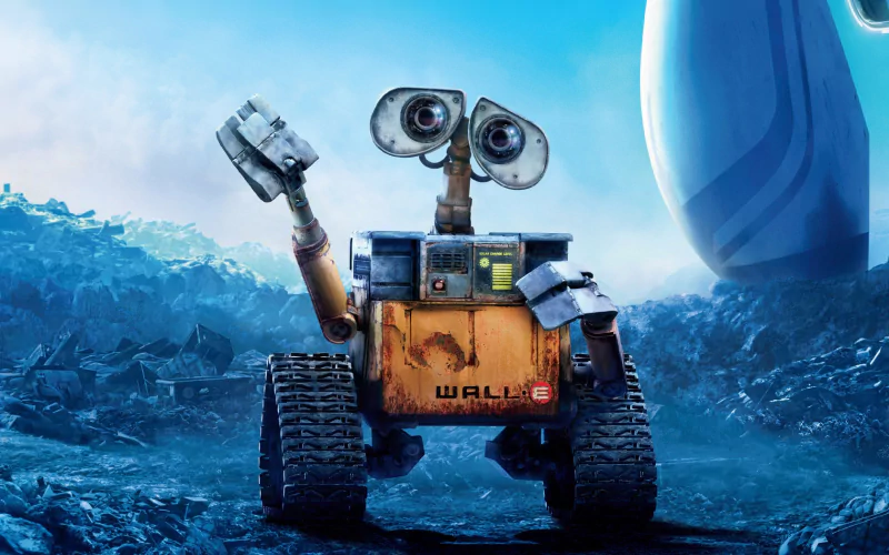 A friendly robot named Wall·E stands in a futuristic, debris-strewn landscape, waving with one arm while showcasing its large, expressive eyes.