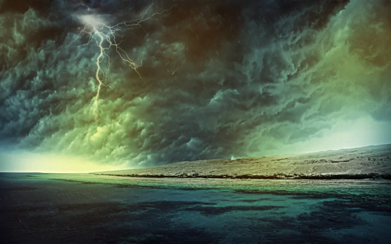 A dramatic seascape featuring dark, swirling clouds illuminated by lightning, showcasing skilled photography manipulation that enhances the mood and intensity of the scene.
