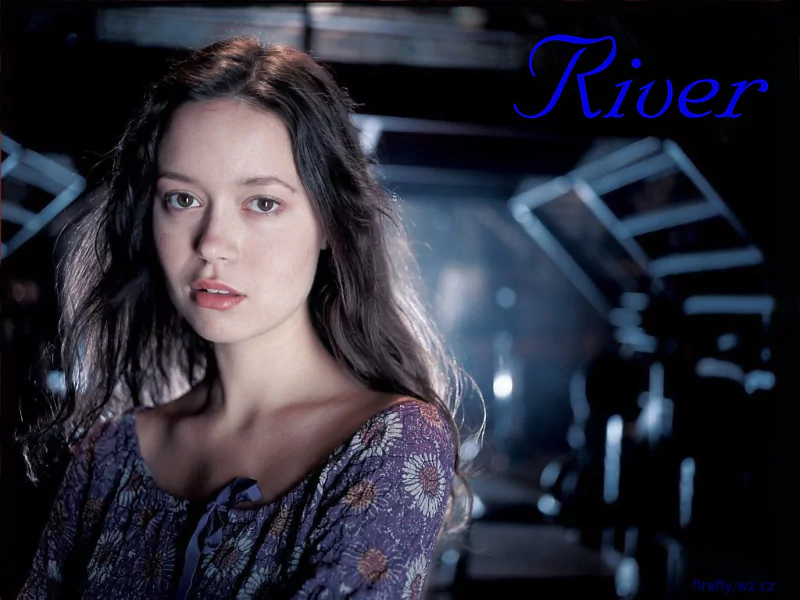 Portrait of River Tam from the TV show Firefly, gazing pensively inside a dimly lit spaceship corridor.