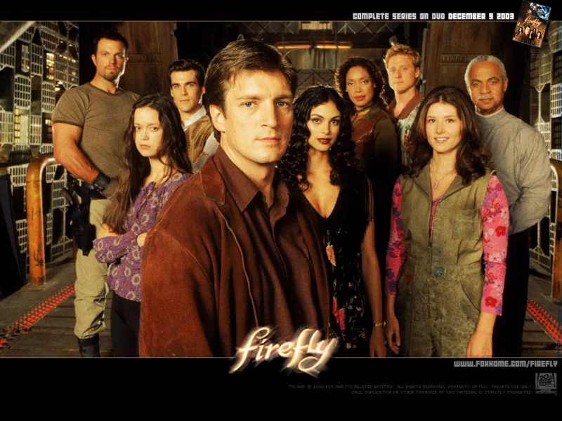 Ensemble cast of the TV show Firefly posed in the Serenity ship corridor, led by Captain Malcolm Reynolds, with the Firefly logo centered along the bottom.