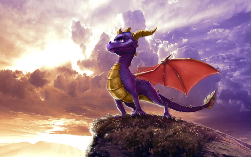 Spyro, the purple video game dragon, stands atop a rocky cliff with red wings spread, gazing over a glowing sunset sky.