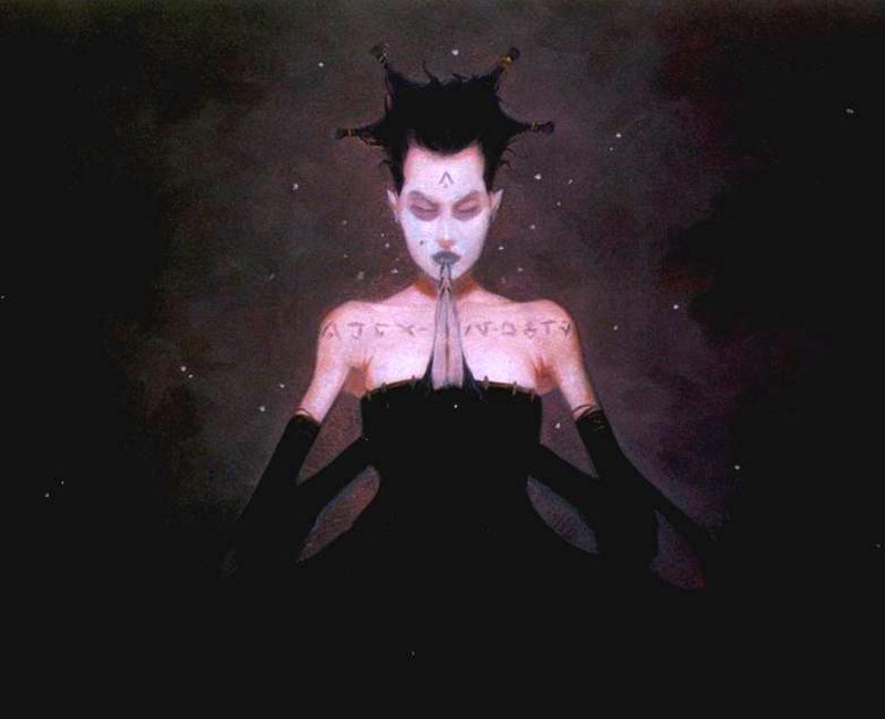 A dark fantasy portrait by Gerald Brom depicts a pale figure with spiked black hair, intricate markings, and hands pressed together in a mysterious, meditative pose.