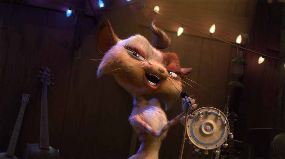 A stylized animated cat plays a tambourine and sings into a microphone on a dimly lit stage with string lights and a guitar in the background.