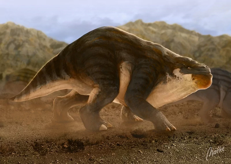 A large dinosaur animal with a bulky body and striped pattern strides across a dusty, rocky landscape with mountains in the background.