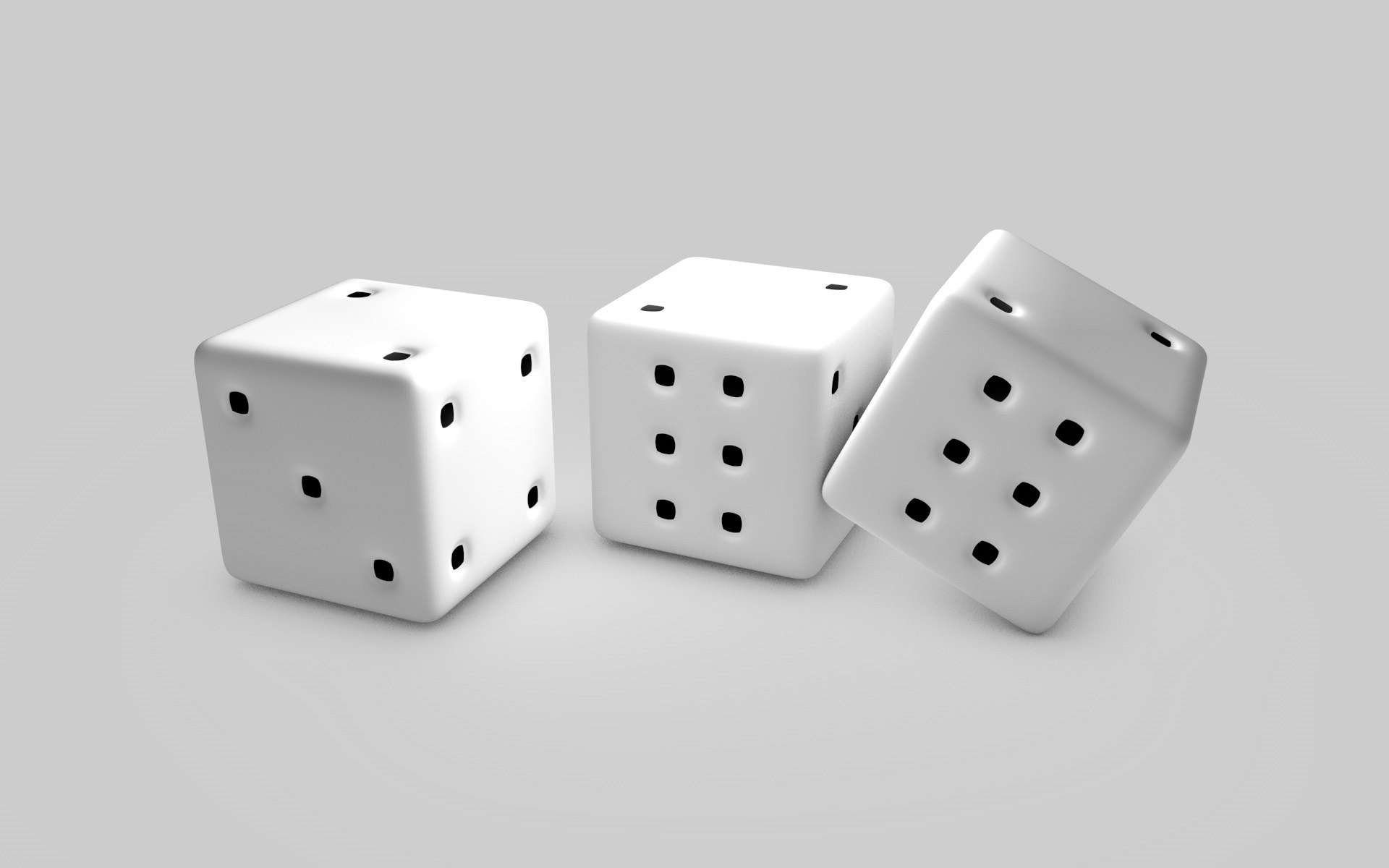 Three white man-made dice with black dots are arranged against a plain gray background.