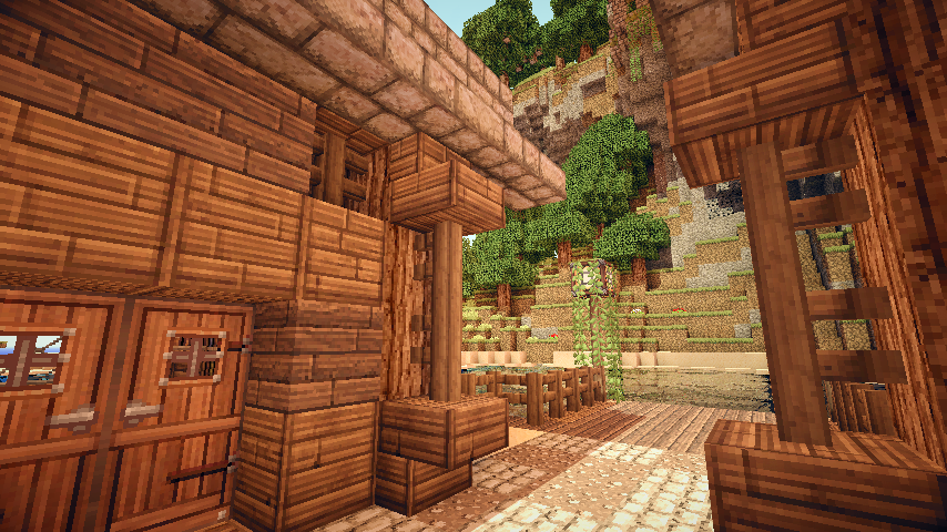 A cozy wooden structure in Minecraft, surrounded by lush trees and textured terrain, showcasing the game's distinctive blocky style and vibrant environment.