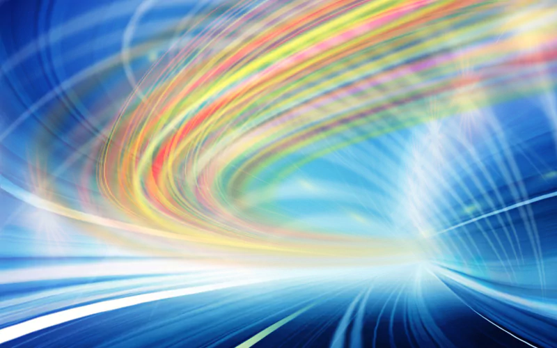 Abstract image featuring dynamic, colorful lines swirling over a blue background, creating a sense of motion and energy.