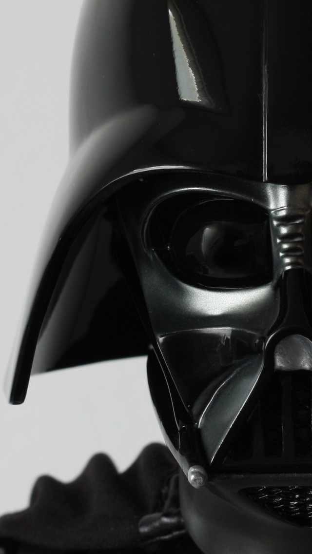 Close-up of Darth Vader’s iconic black helmet from Star Wars, showcasing its glossy sci-fi design and menacing details.