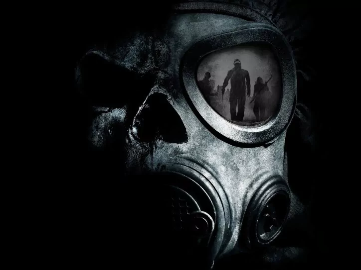 Dark, eerie image of a skull wearing a gas mask with shadowy figures reflected in the mask's lens.