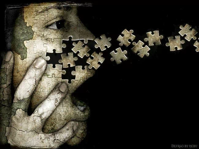 An artistic portrayal of a man's face, where puzzle pieces emerge from his mouth, symbolizing complexity and expression in a striking visual metaphor.