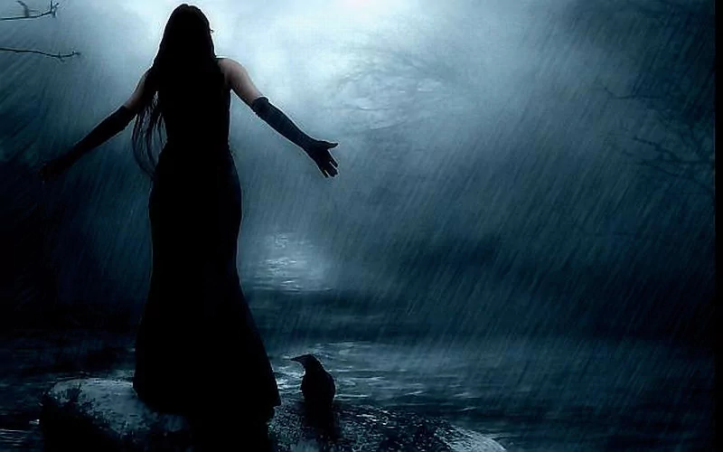 A woman in an emo style stands by a foggy stream, rain falling around her. A raven sits nearby, adding an eerie touch to the dark, atmospheric scene.