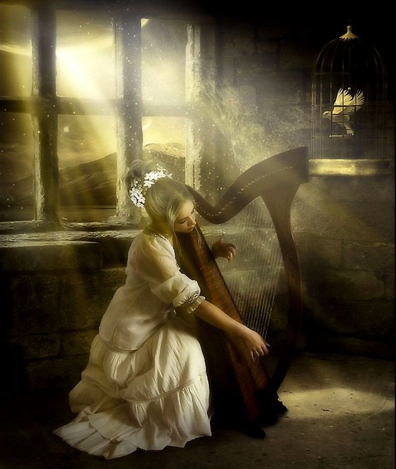A woman in a flowing white dress plays a harp in a sunlit room, surrounded by mountains and flowers, with a birdcage softly illuminated in the background.