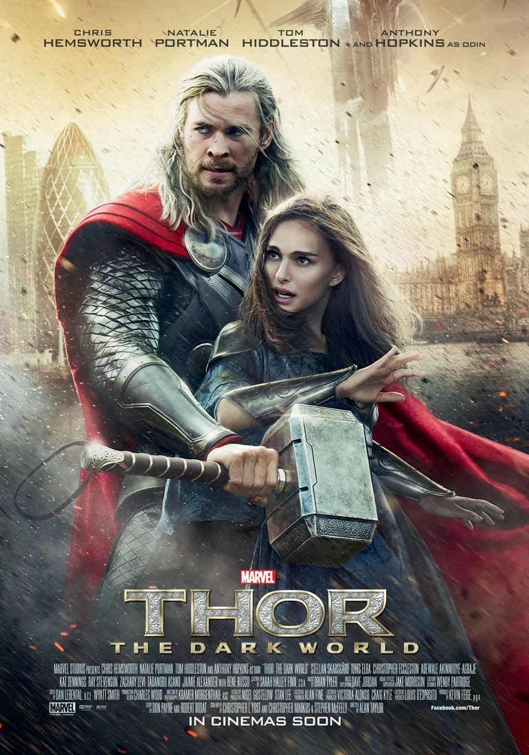 Poster for Thor: The Dark World — armored Thor grips Mjolnir with a woman at his side, red cape billowing, ruined London skyline and Big Ben in a smoky background.