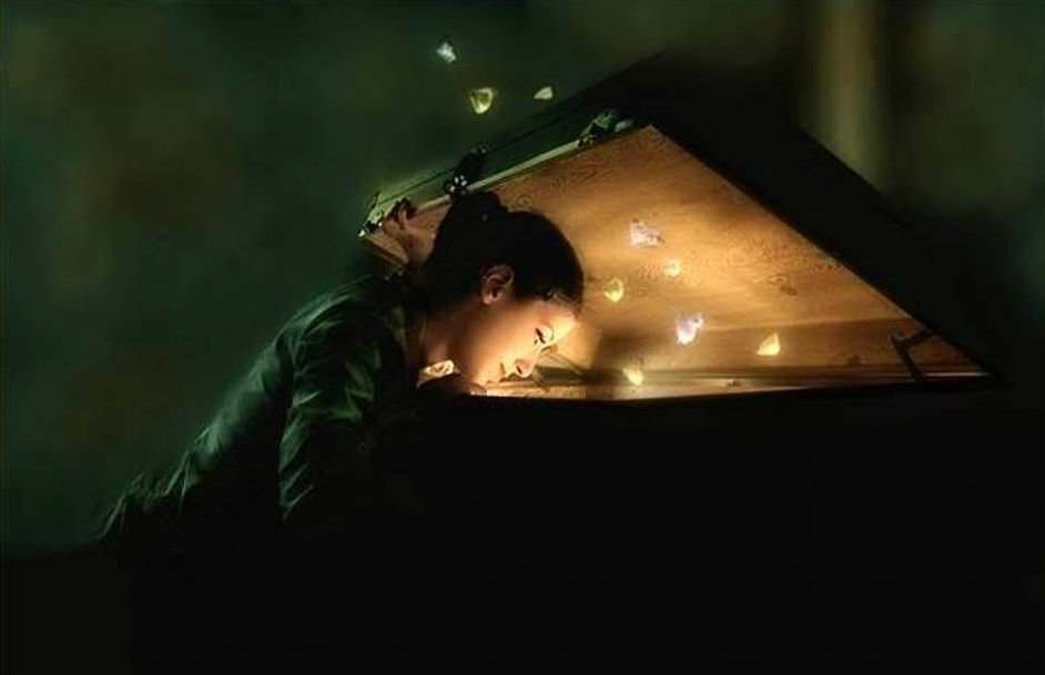 A person peers into an open box, where a soft glow emanates, surrounded by magical butterflies, creating a captivating scene of fantasy and wonder.