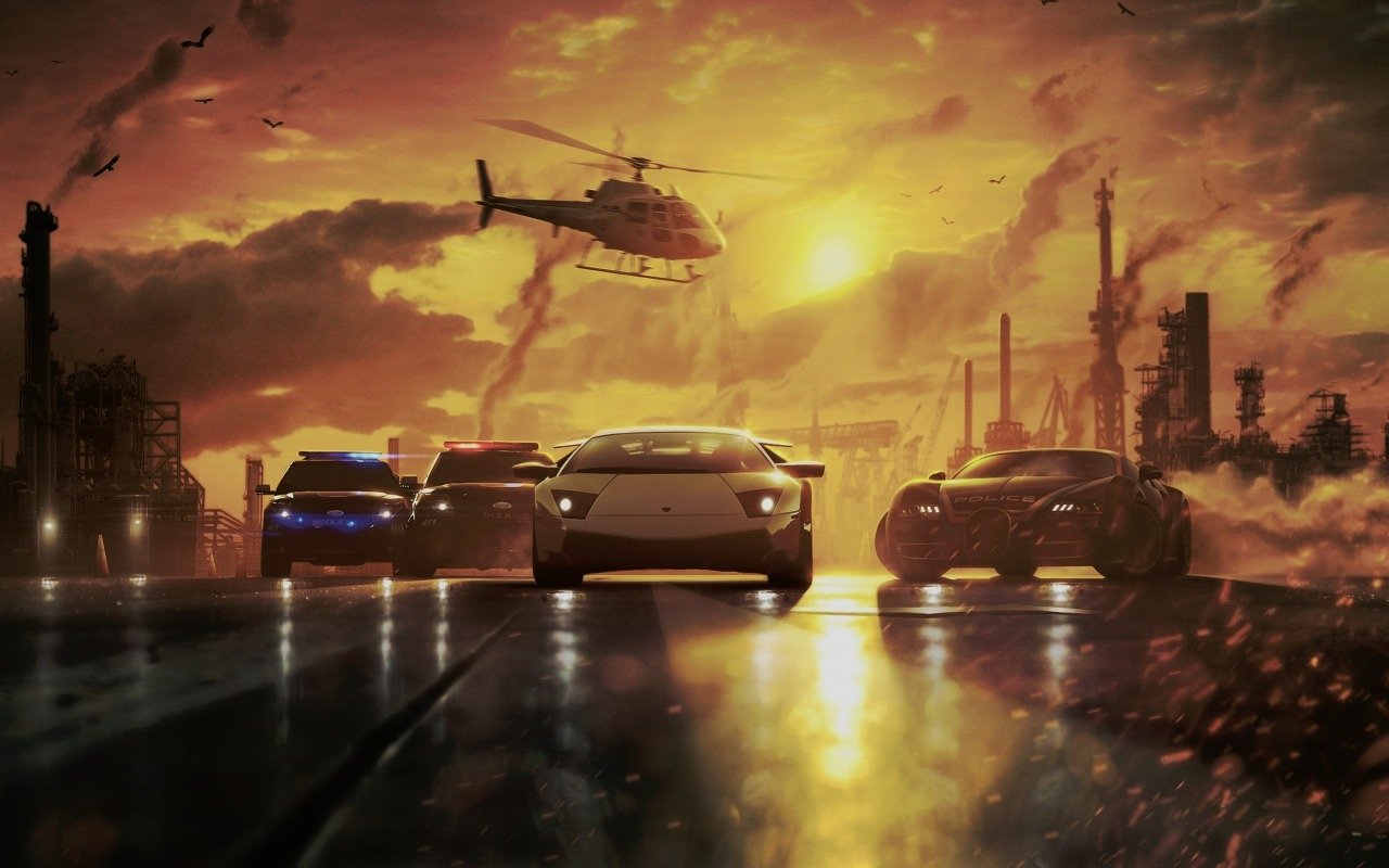 A dramatic scene from the video game Need For Speed: Most Wanted featuring high-speed cars racing on a wet road with a helicopter overhead against a fiery sunset.