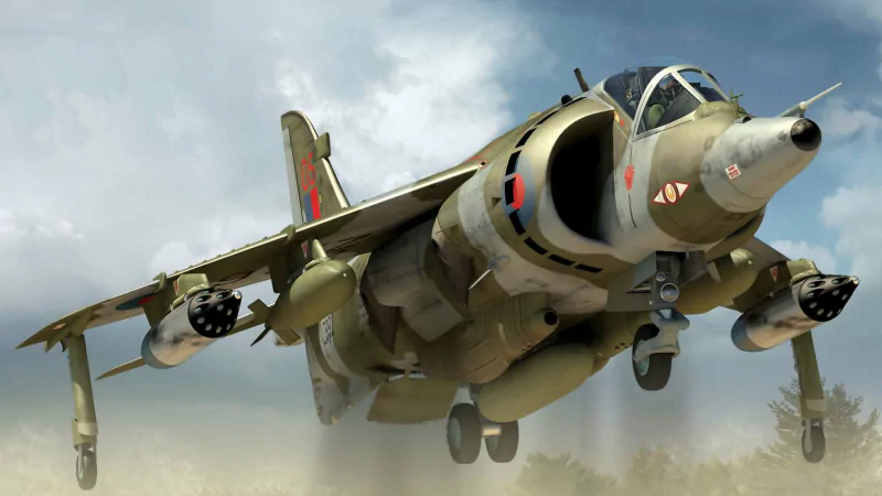 Hawker Siddeley Harrier GR3 military jet in flight, showing its distinctive vertical takeoff capabilities and armaments under its wings.