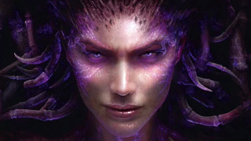 Close-up of Kerrigan, the Zerg Queen of Blades, with glowing purple eyes and organic tendrils — promotional art for the video game StarCraft II: Heart of the Swarm.