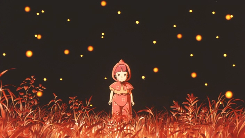 Scene from the anime Grave of the Fireflies: a small girl in a red hooded coat stands in a glowing orange field as fireflies hover around against a dark sky.