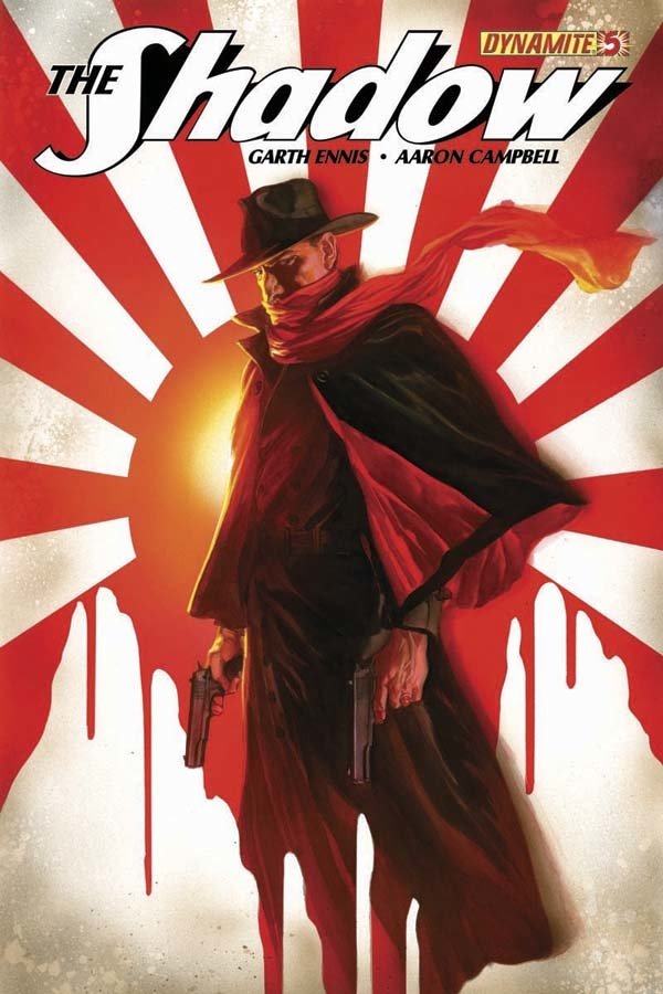 Comic cover of The Shadow featuring a mysterious figure in a wide-brimmed hat and red scarf, holding two guns against a red and white sunburst background.
