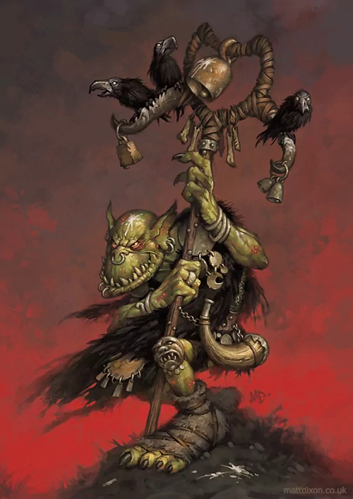Fantasy orc/goblin creature artwork: green-skinned goblin shaman clutching a horned staff adorned with bells and crows, wearing tattered furs and bones against a blood-red sky.